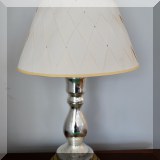 D30. Two toned silver and gold mercury glass lamp with woven shade. 19”h - $28 